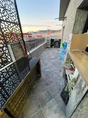 a balcony with a bench and a view at A comfortable apartment in Santa Coloma de Gramanet