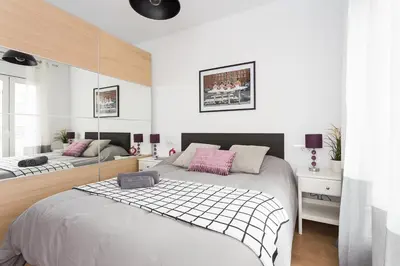 a bedroom with two beds with pink pillows at Opening Doors Sagrada Familia II in Barcelona