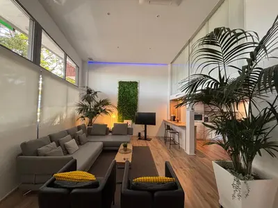 a living room with a couch and a table at Apartment close Barcelona - Rentals Badalona Beach - Free Parking in Badalona
