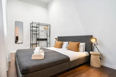 a bedroom with a large bed in a room at Muntaner in Barcelona