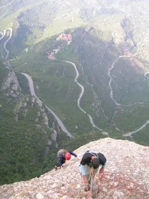 two people standing on the side of a mountain at Climbers Cabin in Marganell