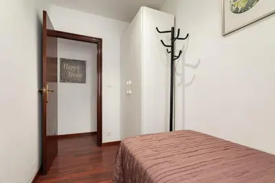 a bedroom with two beds and a window at Camp nou Apartamento in Hospitalet de Llobregat