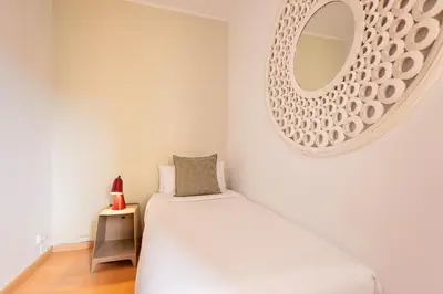 a bedroom with a bed and a mirror on the wall at Sweett - Vicky Barcelona in Barcelona