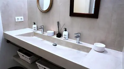 a bathroom with a white sink and a mirror at Entire Flat First Beach line - Sea Views - Vilanova i Geltru in Vilanova i la Geltrú