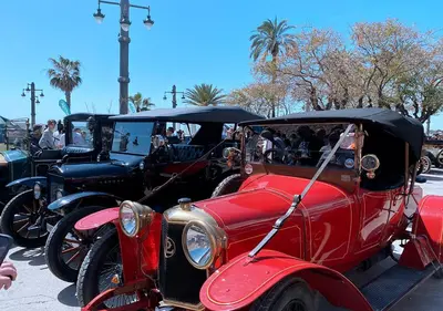 a group of old cars parked in a parking lot at Entire Flat First Beach line - Sea Views - Vilanova i Geltru in Vilanova i la Geltrú