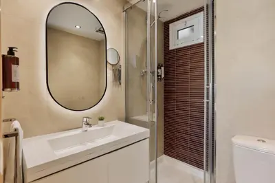 a bathroom with a sink and a mirror at Sitges Group Beach Dreams in Sitges