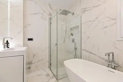 a bathroom with a shower and a tub and a sink at Chez Pablo Barcelona in Cabrils