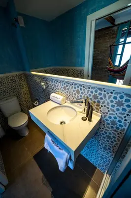 a bathroom with a sink and a toilet at Beach apartment with sea views in Barcelona