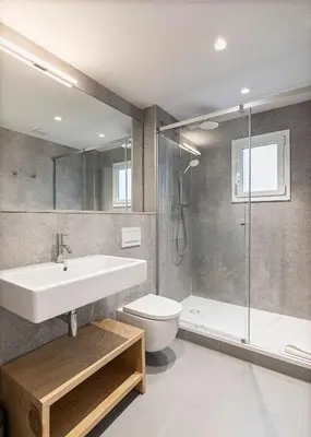a bathroom with a sink and a toilet and a shower at Penthouse with Terrace near Gran Via and Camp Nou in Barcelona