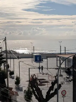 a view of a beach with the ocean in the background at La CASA BLAVA in Cubelles