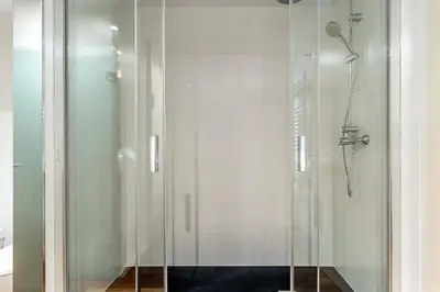 a shower with a glass door in a bathroom at 4101 - AB Passeig de Gràcia Plaça Catalunya I in Barcelona
