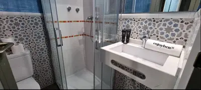 a bathroom with a sink and a shower at Barceloneta Mar Vela -BM14 in Barcelona