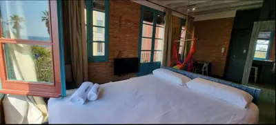 a bedroom with a large bed with white pillows at Barceloneta Mar Vela -BM14 in Barcelona