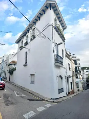a white building on the side of a street at HomeHolidaysRentals Suria - Costa Barcelona in San Pol de Mar