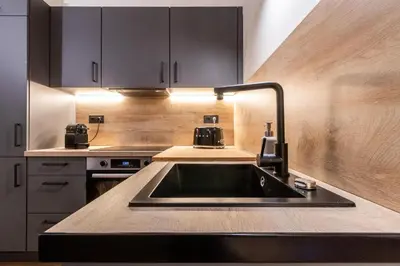 a kitchen with a sink and a counter top at Petit Luxe Del Vall in Terrassa