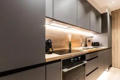 a kitchen with a sink and a stove at Petit Luxe Mutua in Terrassa