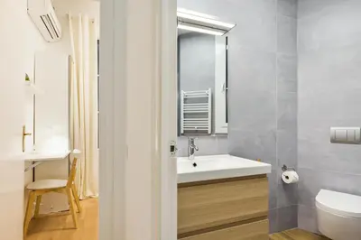 a bathroom with a white sink and a toilet at Barcelona Central Park II in Barcelona