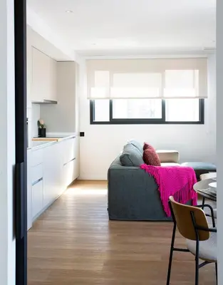a living room with a couch and a table at Durlet Suites by Durlet Apartments in Barcelona