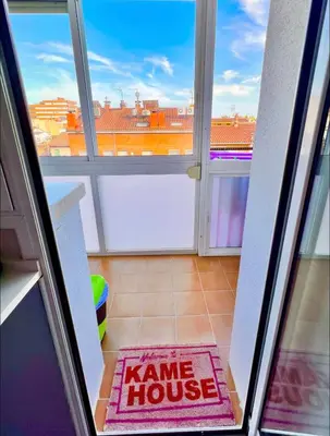 a name house sign on the floor in front of a door at Precioso apartamento al lado de Barcelona centro in Sant Feliu de Llobregat