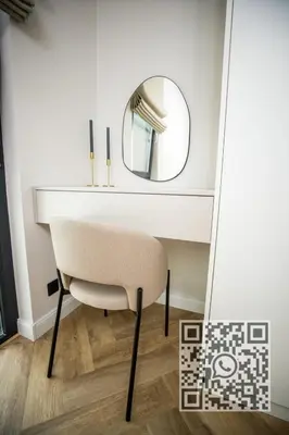 a dressing table with a chair and a mirror at My White Vilanova Home in Vilanova i la Geltrú