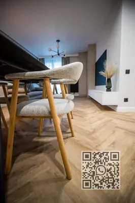 a dining room with a chair and a table at My White Vilanova Home in Vilanova i la Geltrú