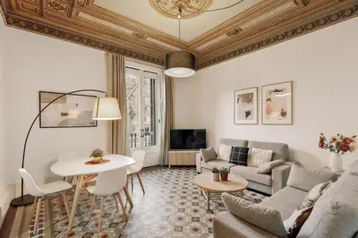 a living room with a couch and a table at Ola Living Arc de Triomf in Barcelona