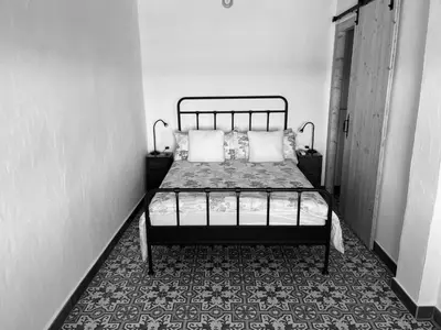 a bedroom with a bed in a room at La Casita Soler The Soler Cottage in Arbós