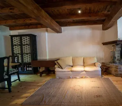 a living room with a white couch and a table at Apartamento montaña en Arties in Artés