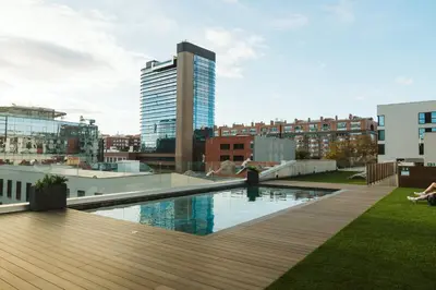 a pool on the roof of a building at BLAU Student Housing - Students Only in Barcelona