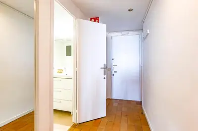 a room with a white door and a closet at Penelope Apart in Sitges