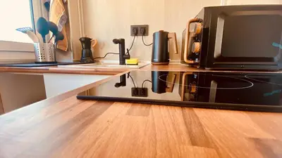 a microwave sitting on top of a counter at LEB Apartments in Pineda de Mar