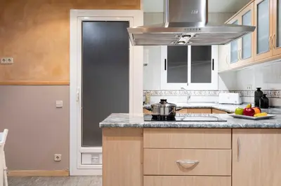 a kitchen with a sink and a stove at AB Princep Jordi in Barcelona