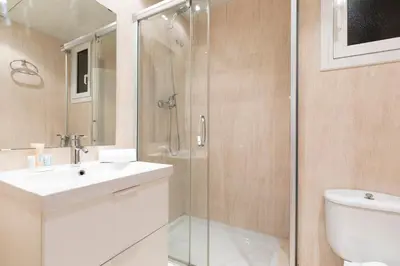 a bathroom with a shower and a sink and a toilet at AB Princep Jordi in Barcelona