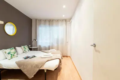 a bedroom with a bed and a shower at AB Princep Jordi in Barcelona