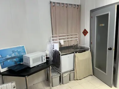 a small kitchen with a sink and a microwave at Tessasapartments Sabadell 4 in Sabadell