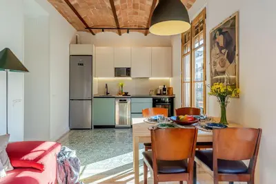 a kitchen and dining room with a table and chairs at 2088 - AB Sagrada Familia in Barcelona
