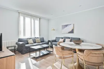 a living room with a couch and a table at Alcam Mallorca 22 in Barcelona
