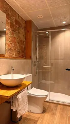 a bathroom with a sink and a toilet and a shower at La Fira - Paralelo 2 in Barcelona