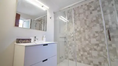 a bathroom with a glass shower and a sink at SeaHomes Vacations - Villa Chill & Pool 200m Beach in Pineda de Mar