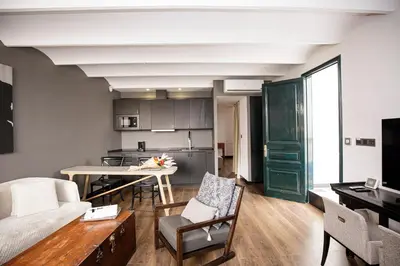 a living room with a couch and a table at luminous top floor apartment with terrace in Barcelona