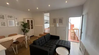 a living room with a couch and a table at Piso Centro Badalona in Badalona