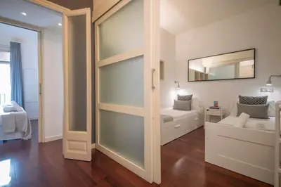 a living room with a sliding glass door at Apartamento de 3 habitaciones en Sant Antoni in Barcelona