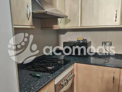 a kitchen with a stove and a counter top at Passatge Concepcio in Hospitalet de Llobregat