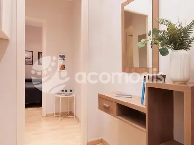 a bathroom with a vanity and a mirror at Vigatans in Barcelona