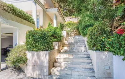 a staircase leading up to a house with plants at 5 Bedroom Amazing Home In Cabrils in Cabrils