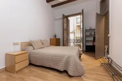 a bedroom with a bed and a television in it at ApartEasy - PURE GRACIA, excellent location in Barcelona
