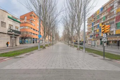 an empty street in a city with buildings at Playa a pie y a 15 minutos de Ramblas y Plaza Catalunya en metro in Sant Adria de Besos