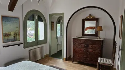 a bedroom with a dresser and a mirror on a dresser at Can Puig Barata, Aiguafreda in Aiguafreda