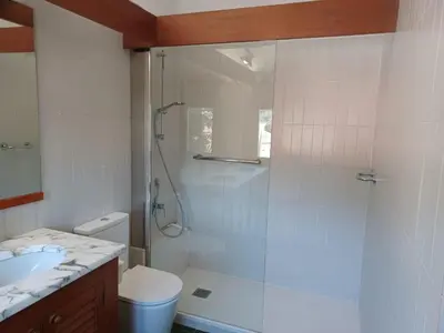 a bathroom with a shower and a toilet and a sink at Can Puig Barata, Aiguafreda in Aiguafreda