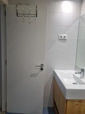 a white bathroom with a sink and a shower at 1 Habitación Matrimonial Privada con baño incluido in Barcelona